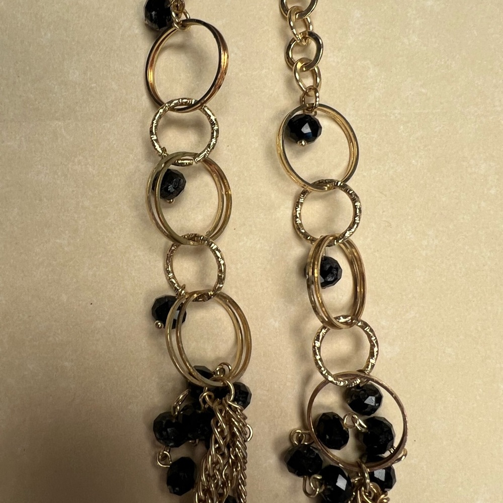 Long black and gold tone neckless